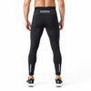Pantalones deportivos ajustados con ribetes reflectantes y capa base de compresión para hombre